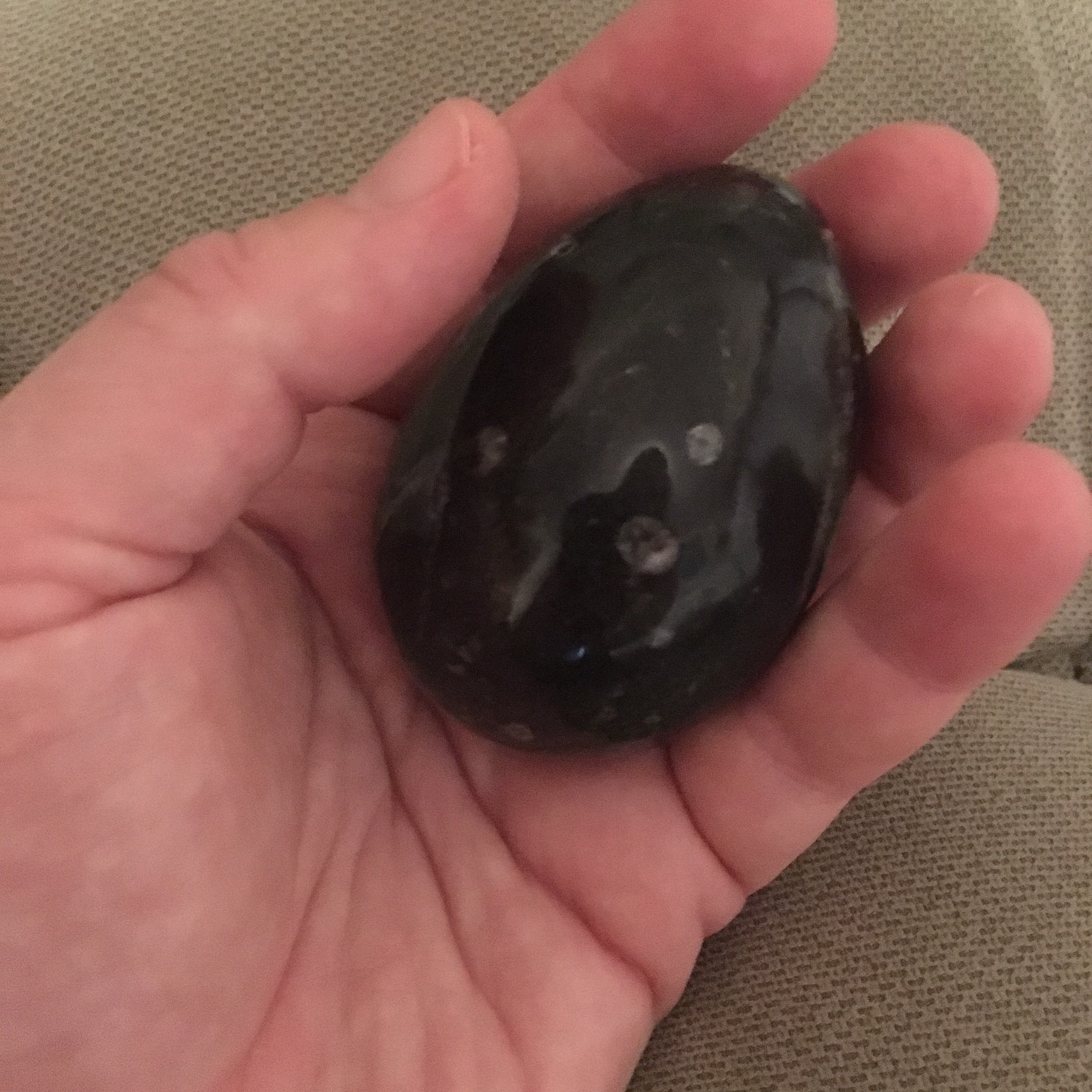 This snowflake obsidian rock fits well in my hand and offers enough weight and size to register strongly with my brain as I pass it back and forth between my hands.